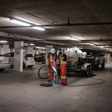 Specialized vacuum trailer that fits within the tight confines of parkades.